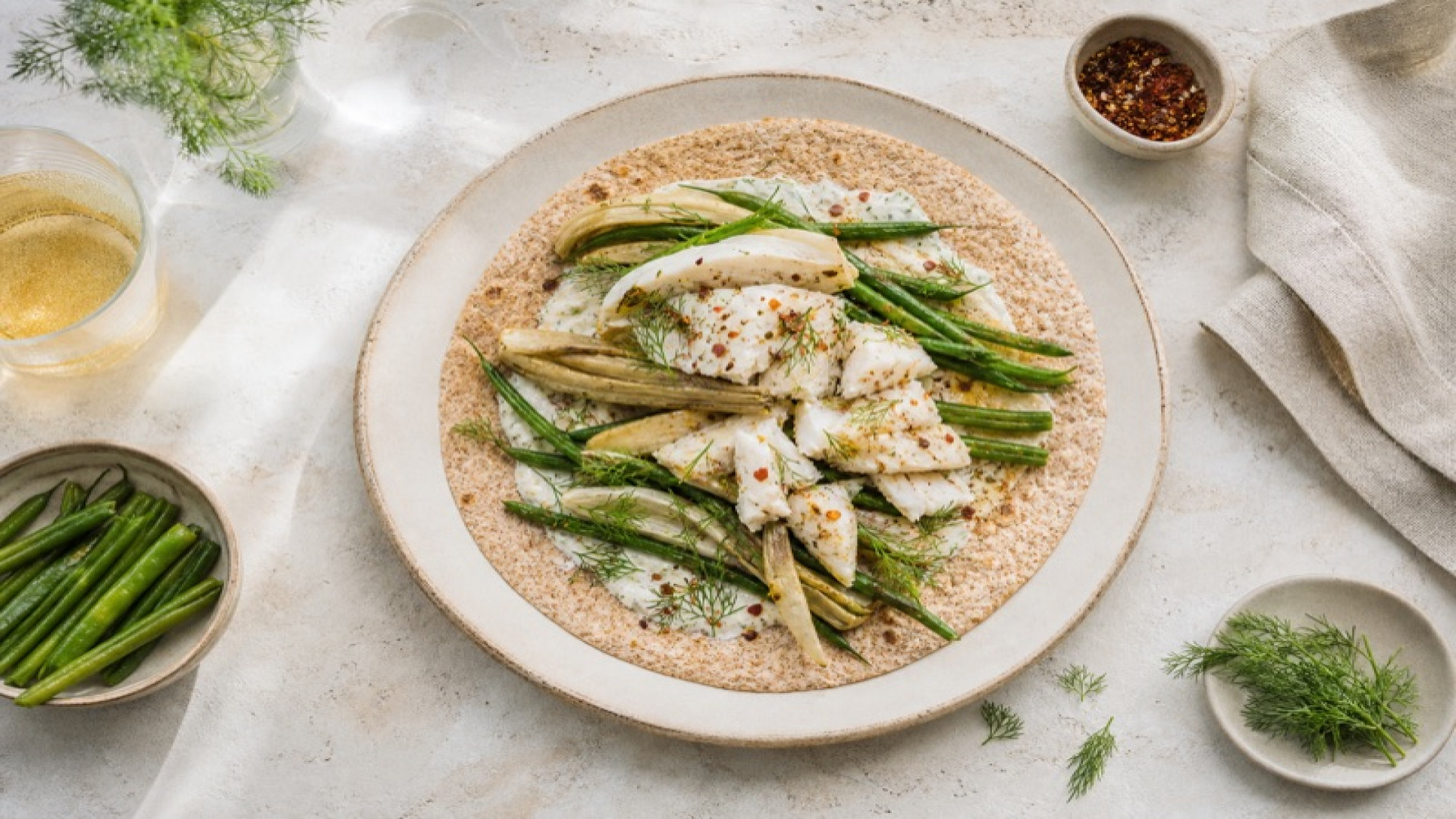 Gerösteter Fenchel-Wrap mit Alaska-Seelachs und Keniabohnen